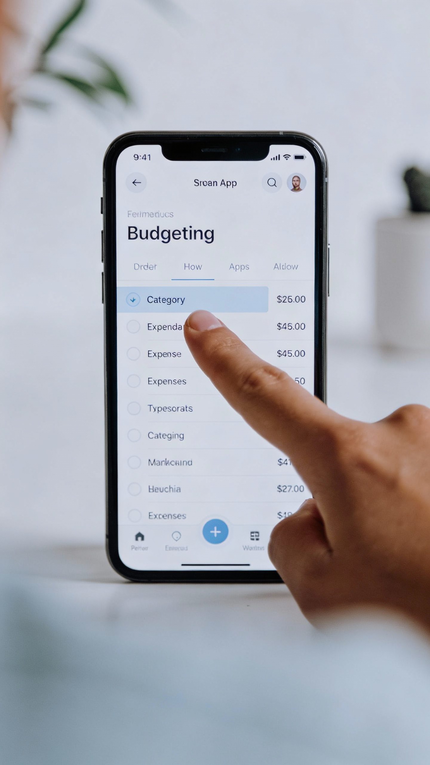 single open budgeting app on smartphone, thumb hovering to categorize