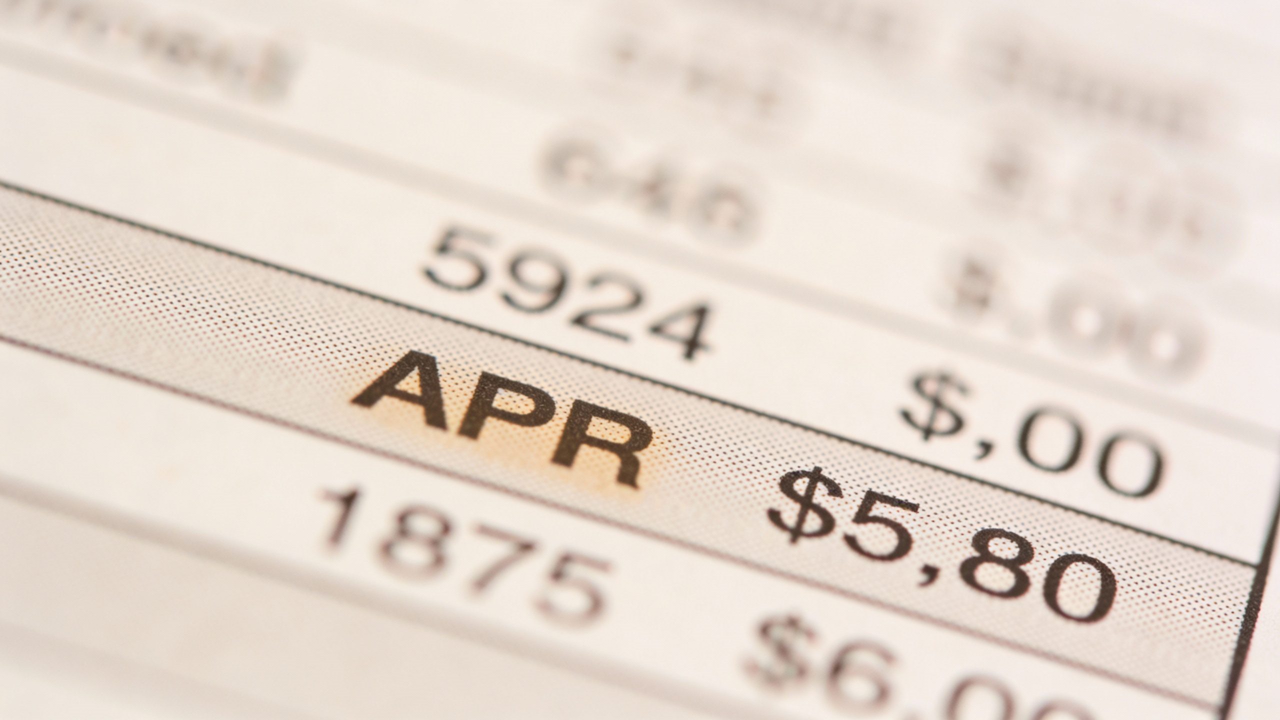 single credit card statement with highlighted APR, macro shot