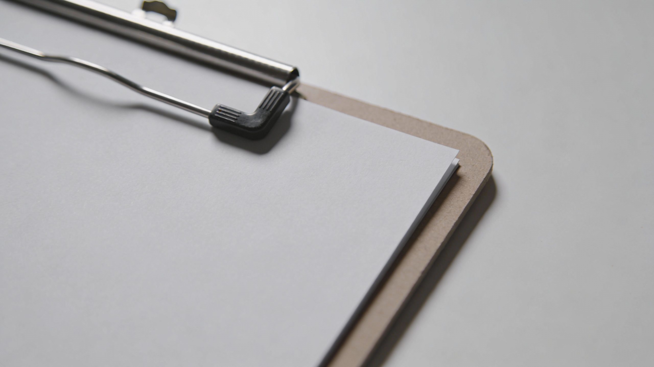 minimalist one-page debt snapshot on clipboard, top-down closeup