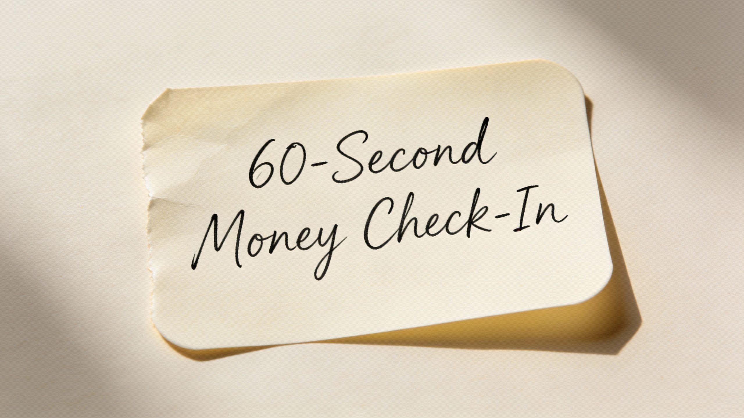 **Single handwritten sticky note with '60-Second Money Check-In'**