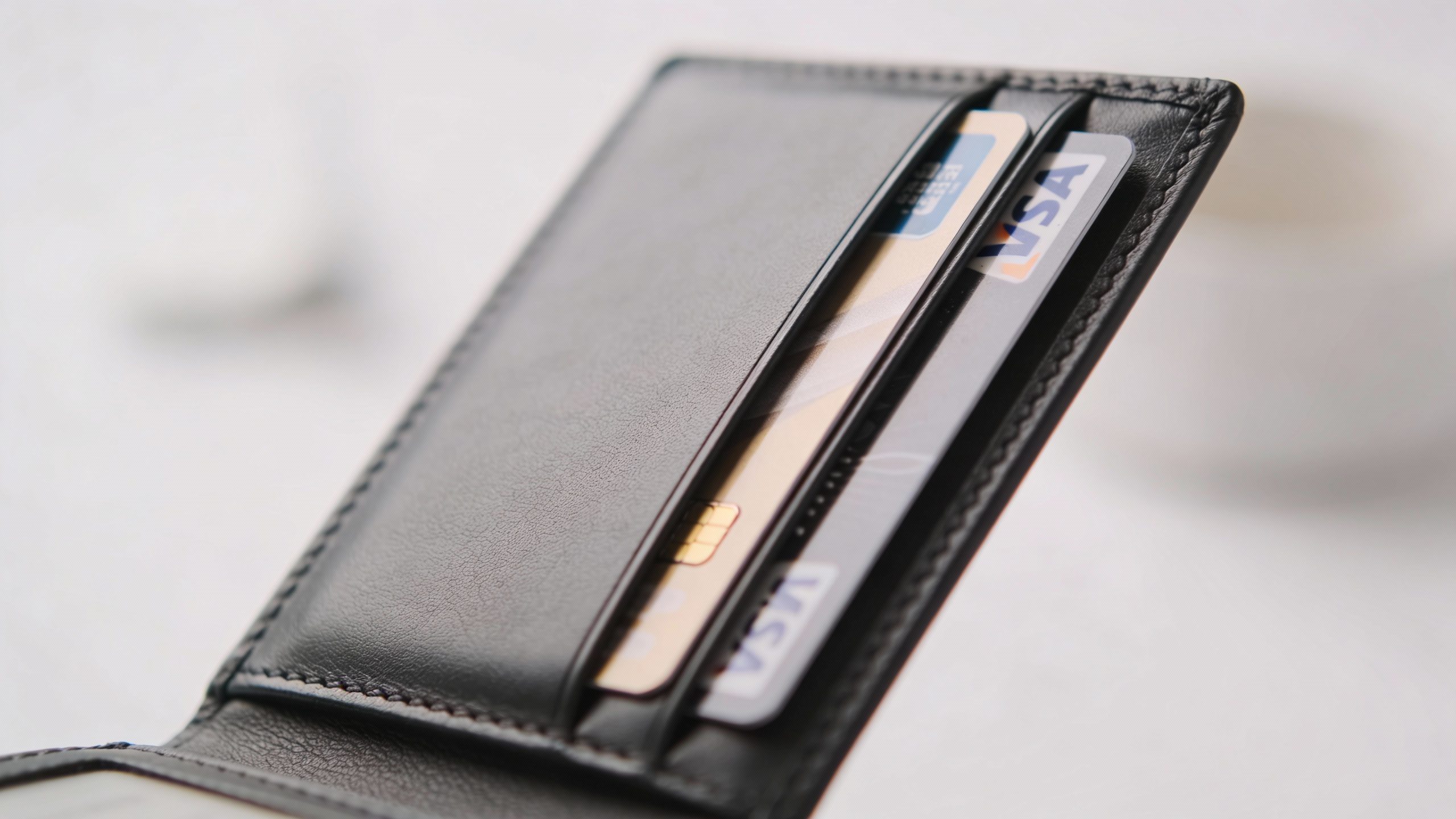 **Closeup of a minimalist wallet with only essential cards**