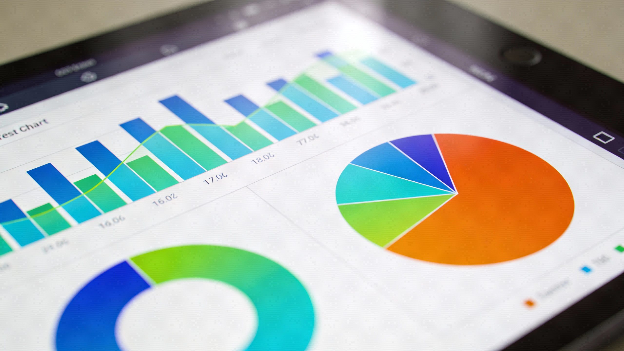 **Closeup of digital tablet with colorful expense chart**