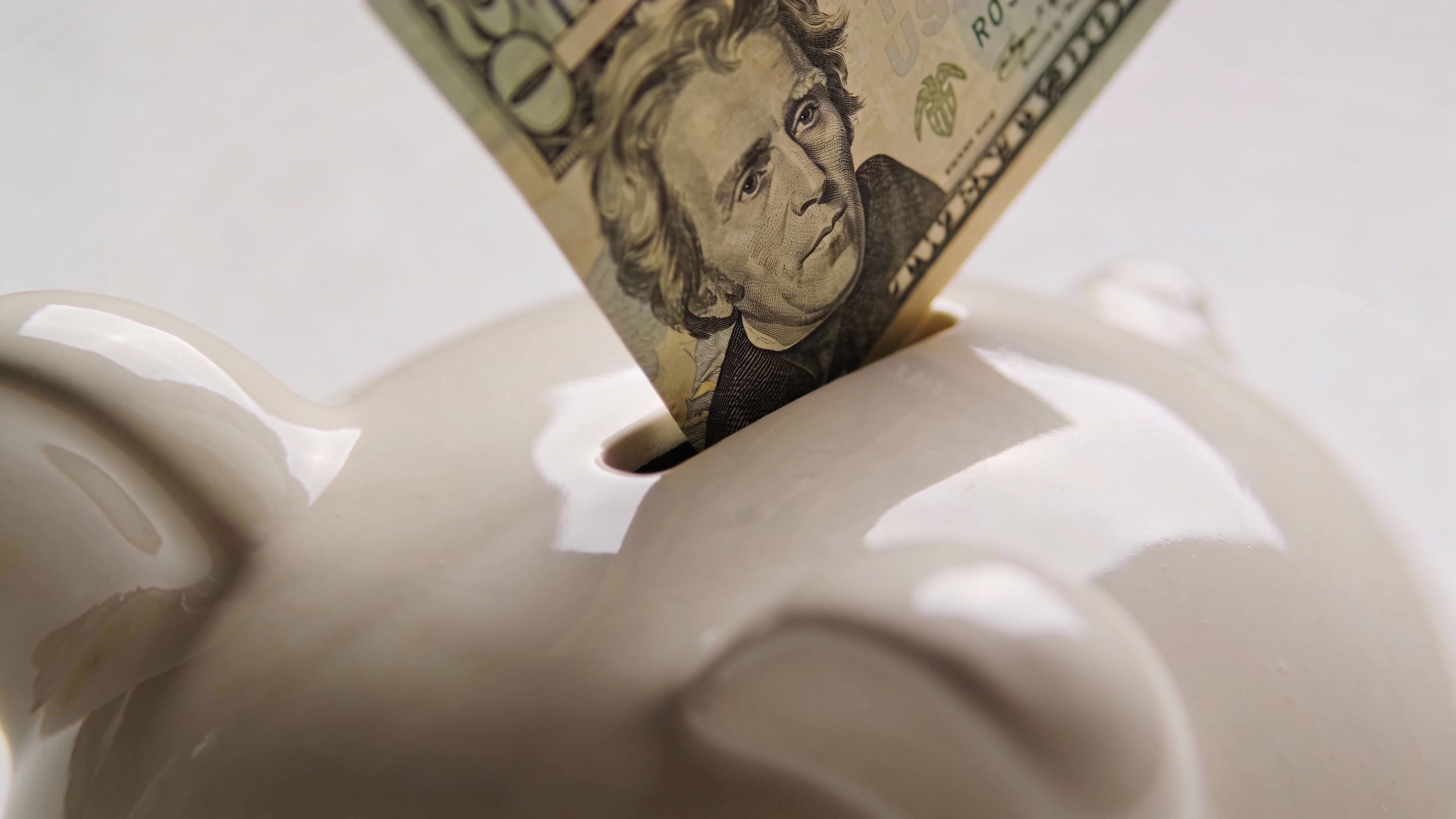 **Closeup of a piggy bank with a $20 bill inserted**  Each prompt focuses on a clear, professional shot with no extra elements. Let me know if you'd like any refinements!