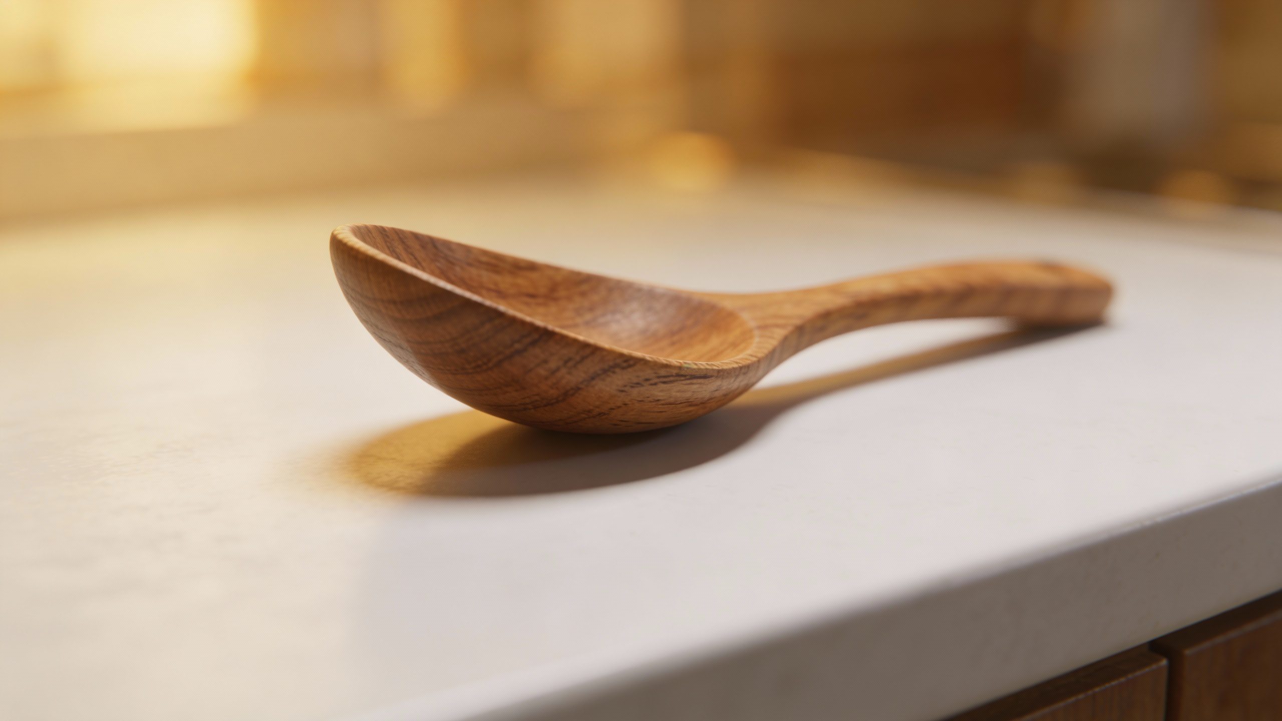 **Closeup of a single wooden spoon on a clean counter**