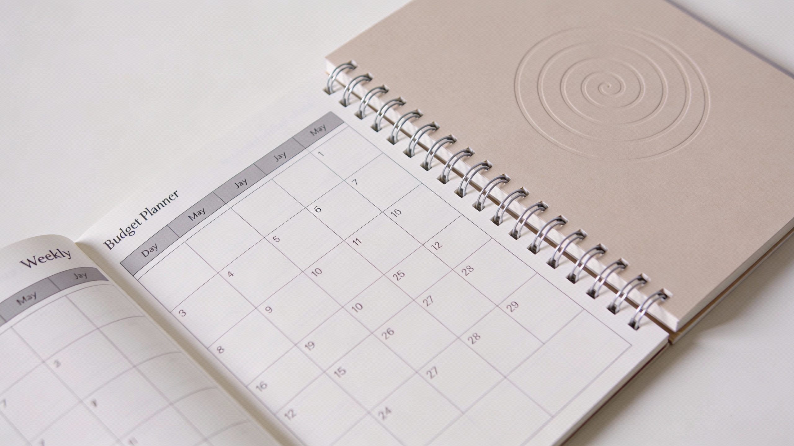 single spiral budget planner notebook with weekly layout