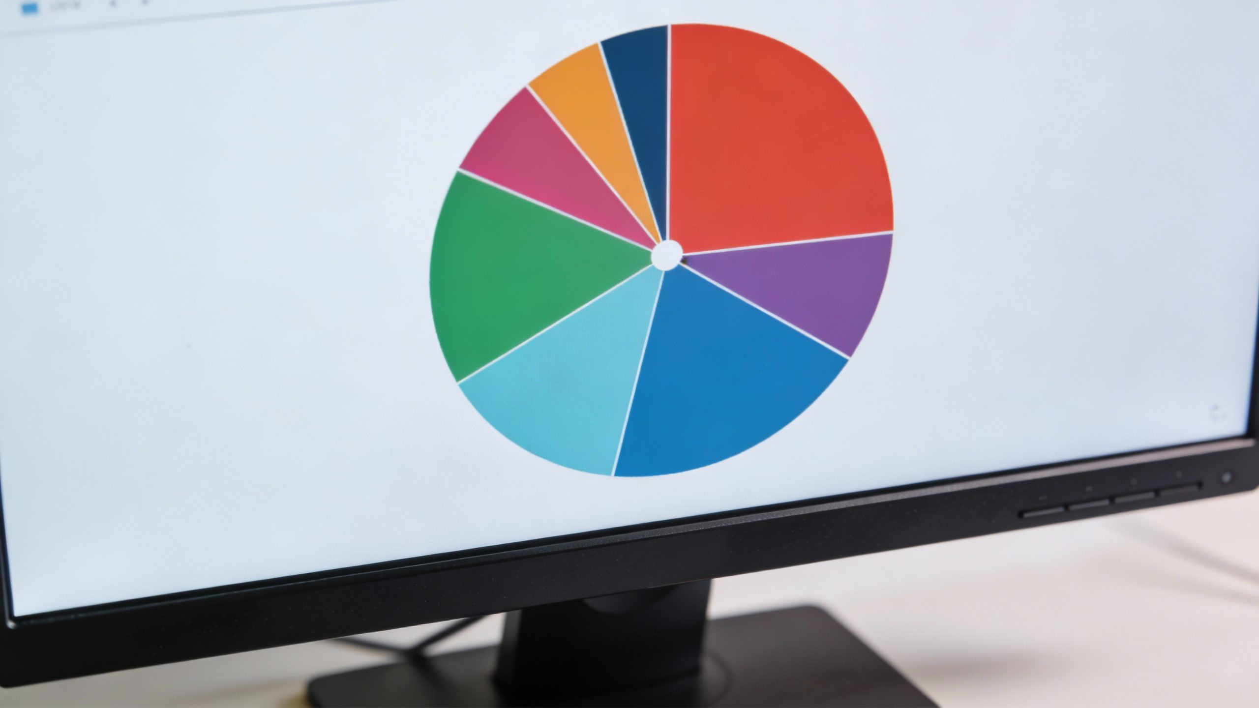 **Closeup of a diversified pie chart on a monitor** Each prompt ensures a focused, professional shot while directly reflecting key concepts from the article (market tracking, simplicity, diversification).