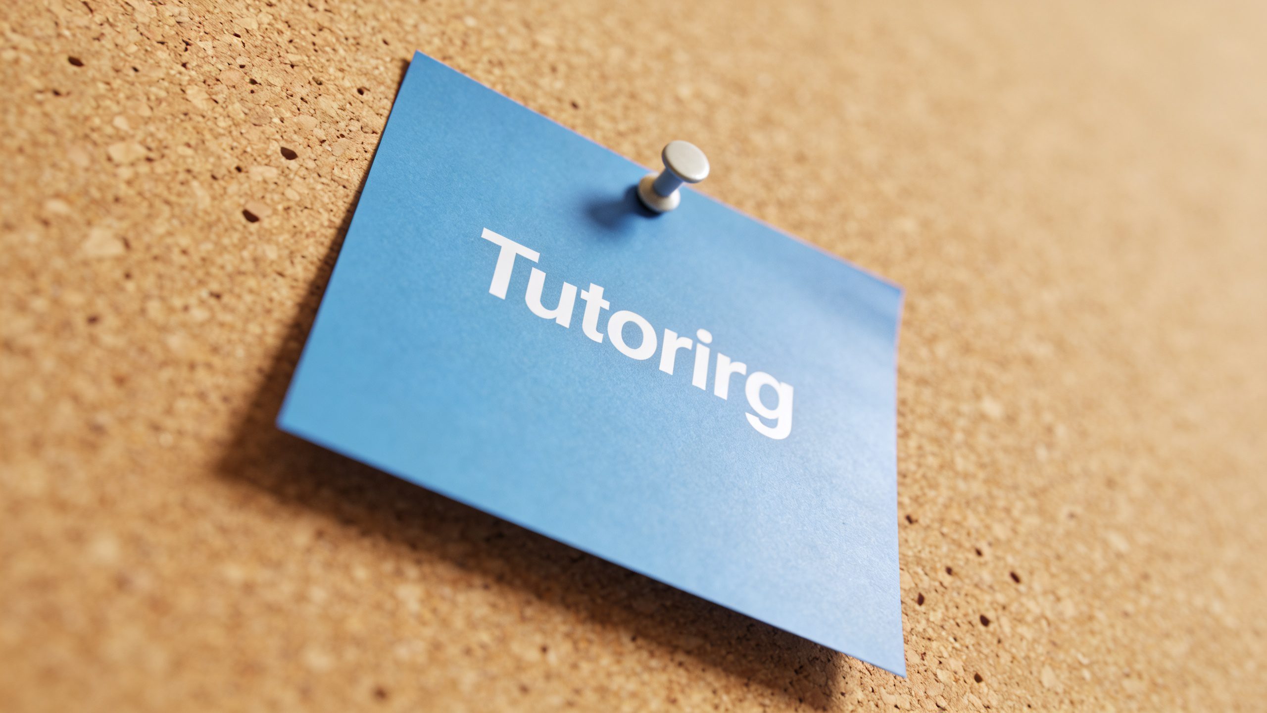 single blue tutoring flyer pinned to corkboard