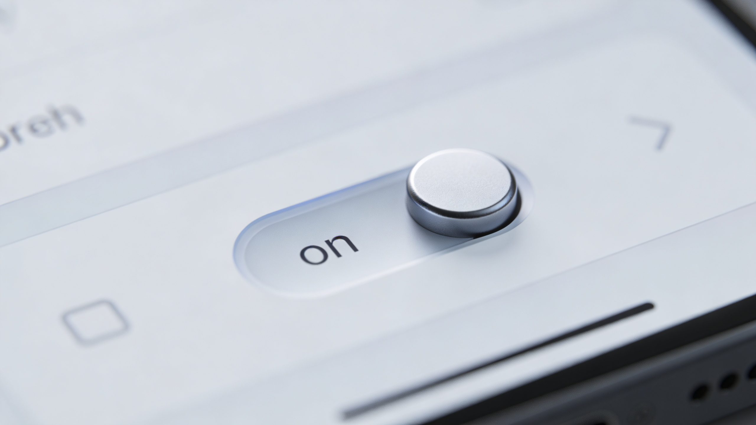 closeup of automatic dividend reinvestment toggle on brokerage app