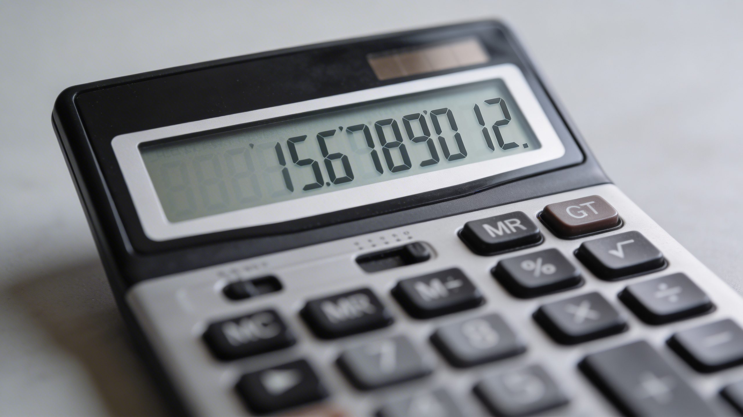 Closeup of a single calculator displaying reduced total debt balance