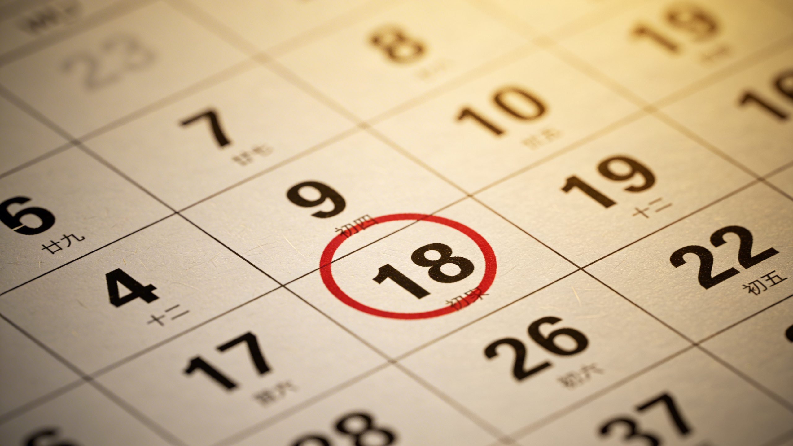 Focused shot of a single calendar page highlighting a deadline date