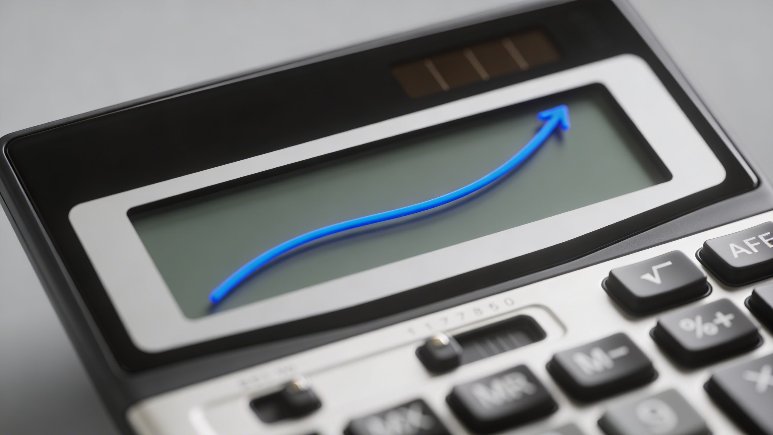 closeup of a single calculator showing a growth chart on screen