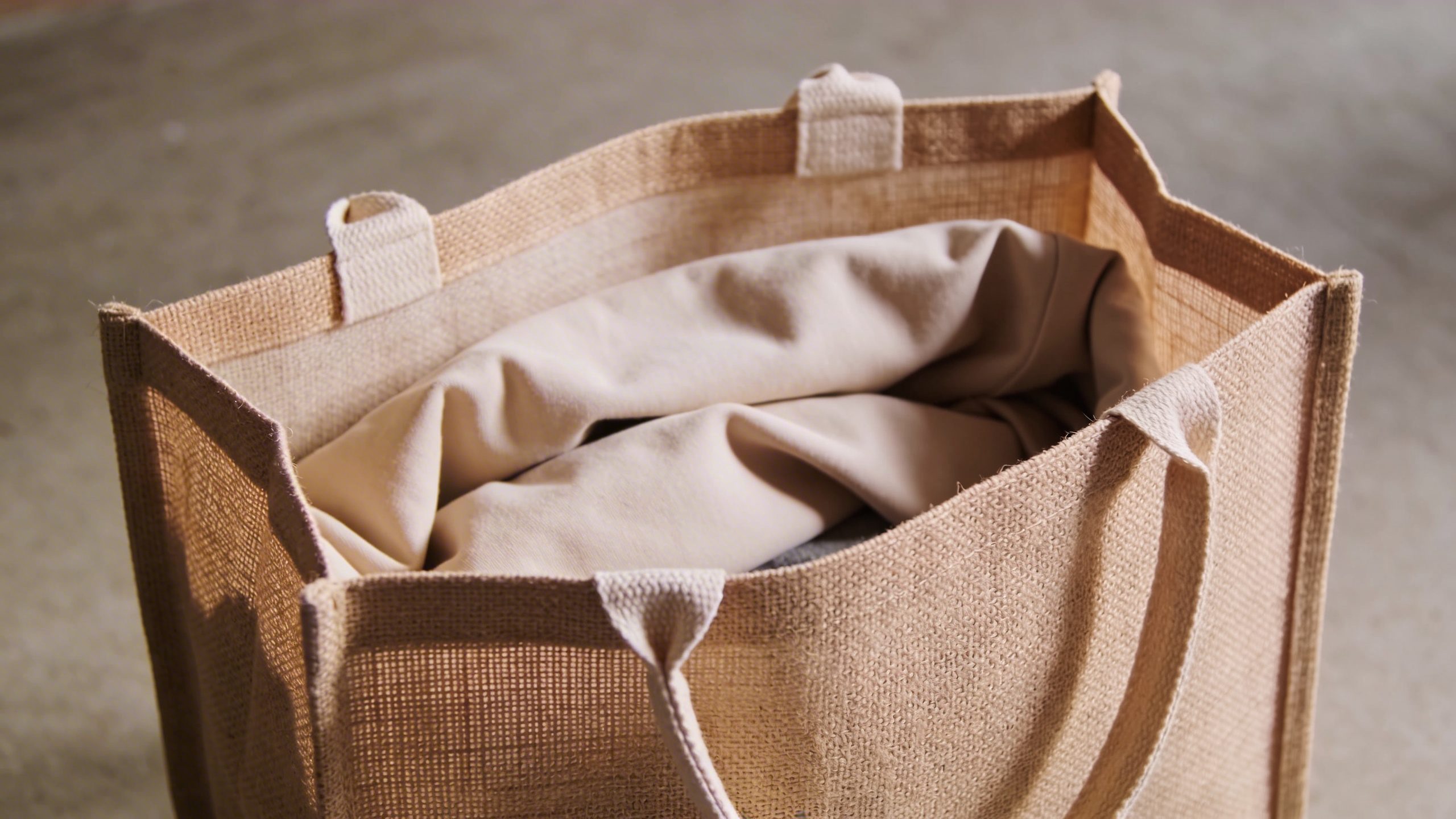 closeup of a single reusable shopping bag being filled