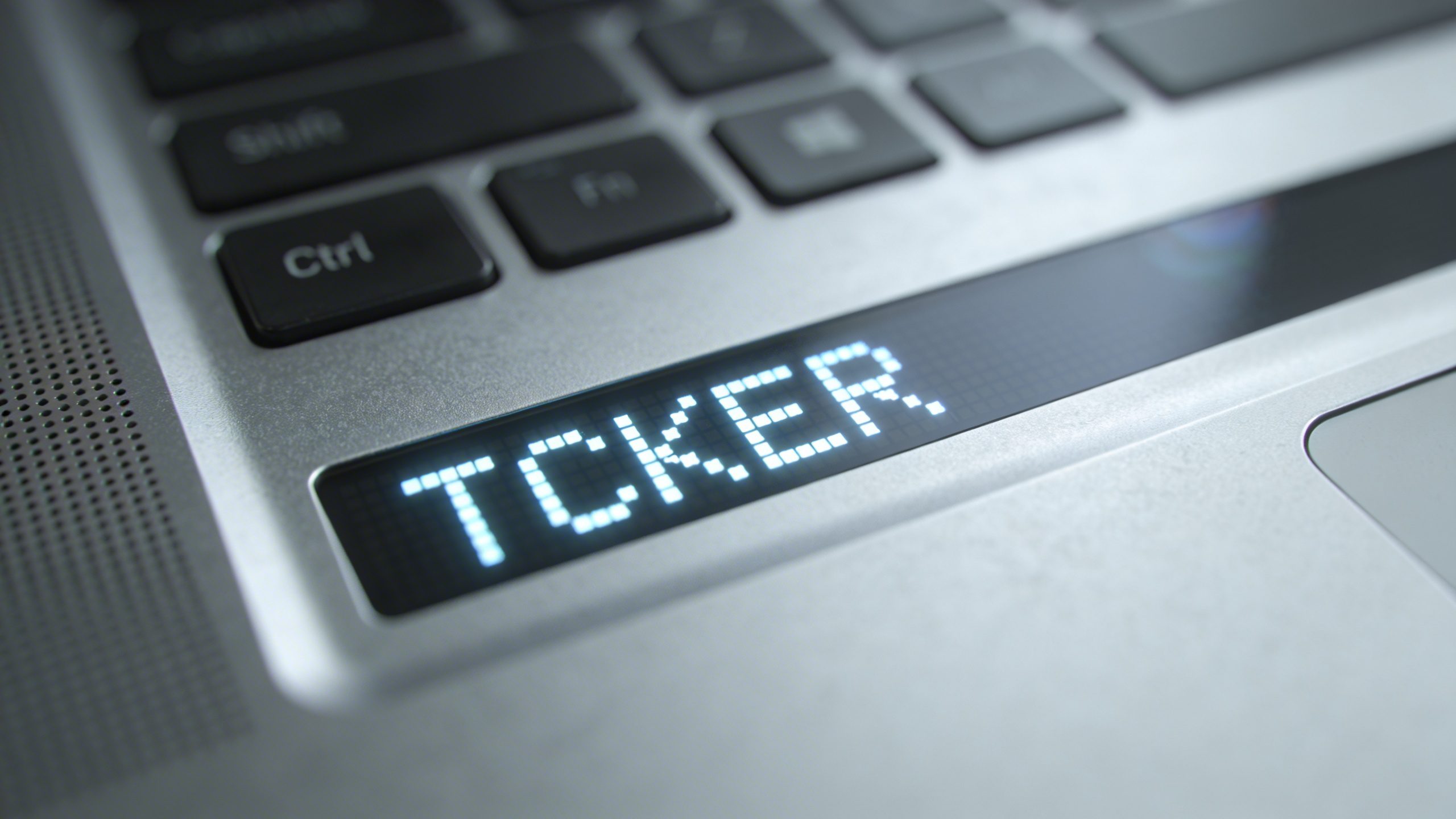 Closeup of a single ETF ticker on a laptop screen in focus