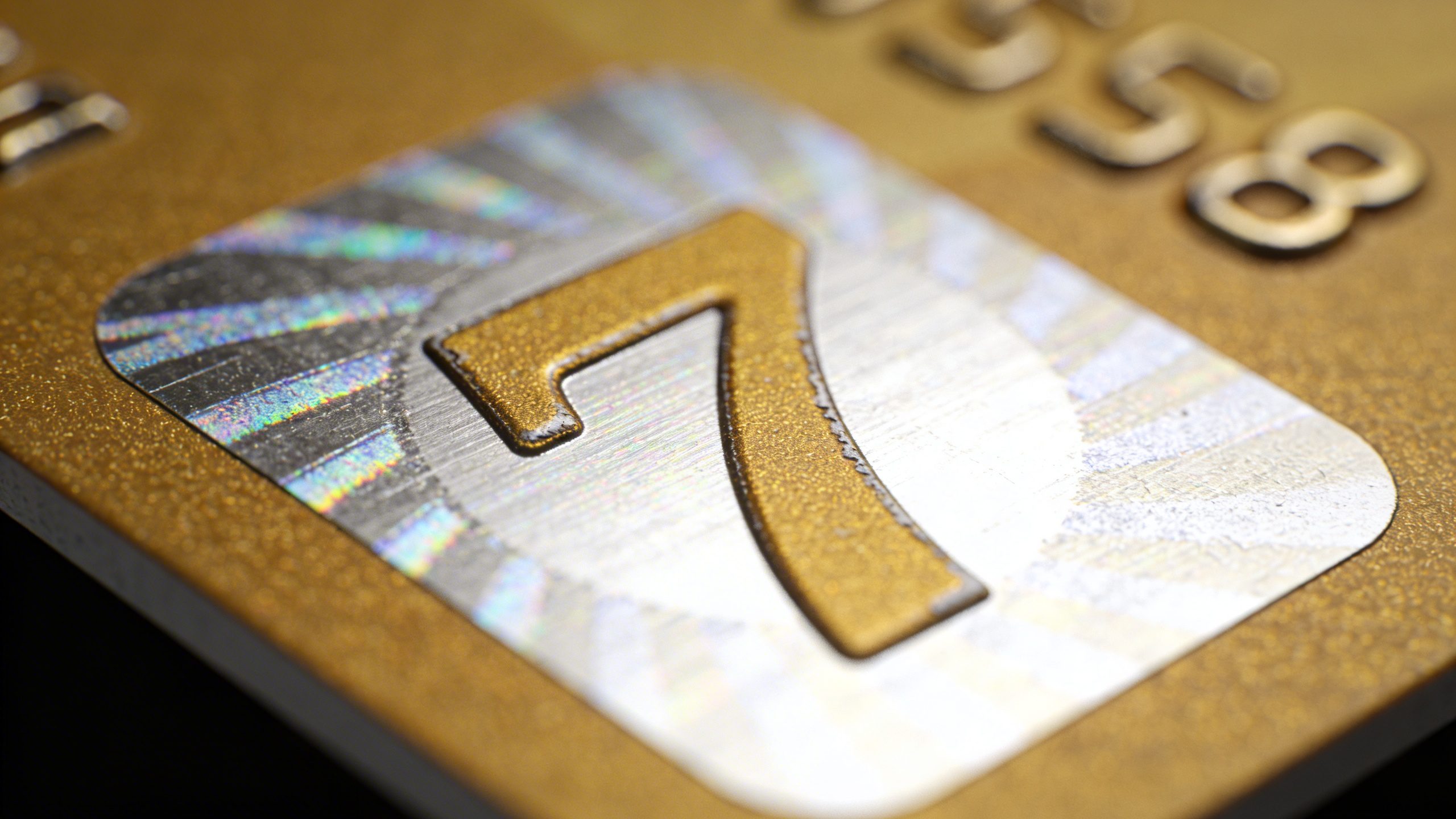 Closeup of a single-digit high-interest debt payoff sticker on a credit card