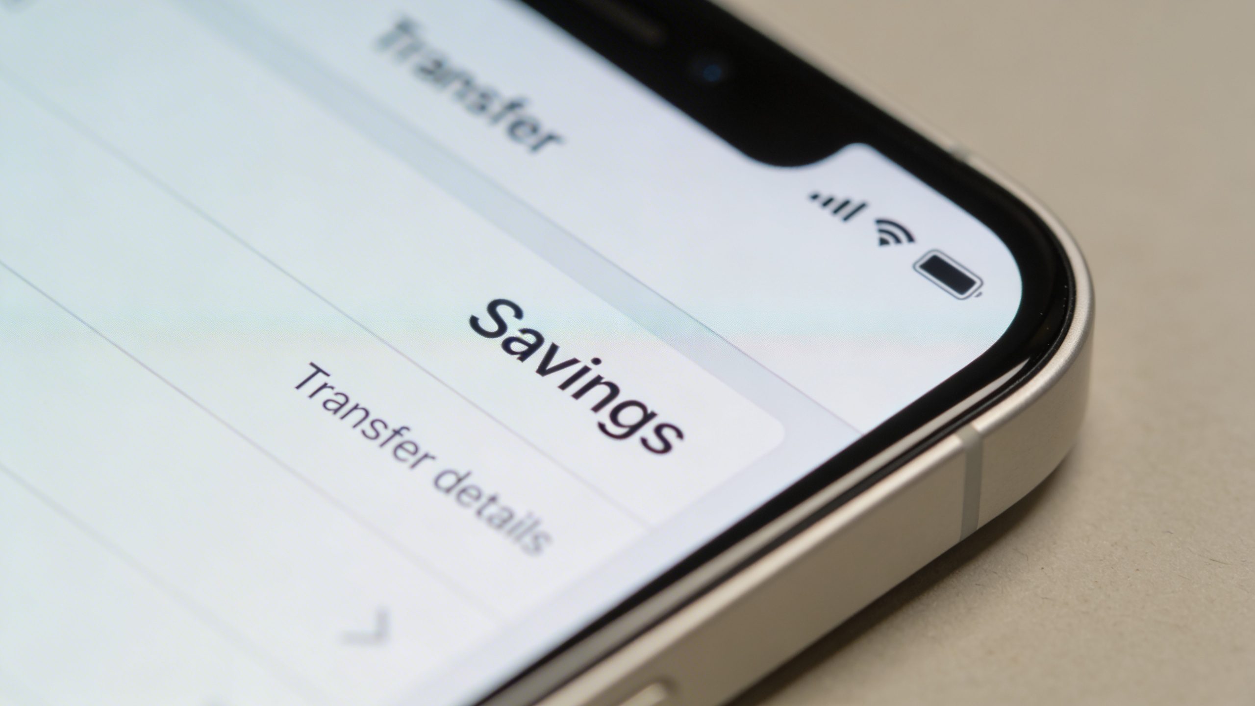 Closeup of a labeled “Savings” transfer on a smartphone screen
