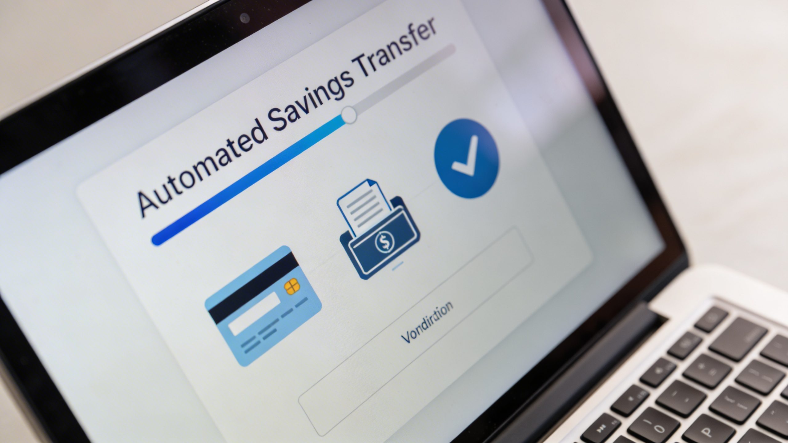 closeup of automated savings transfer on a laptop screen