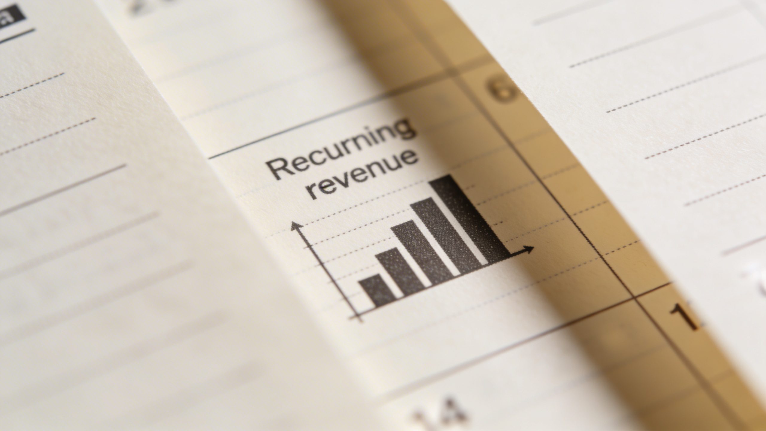 closeup of a calendar page showing monthly recurring revenue graph
