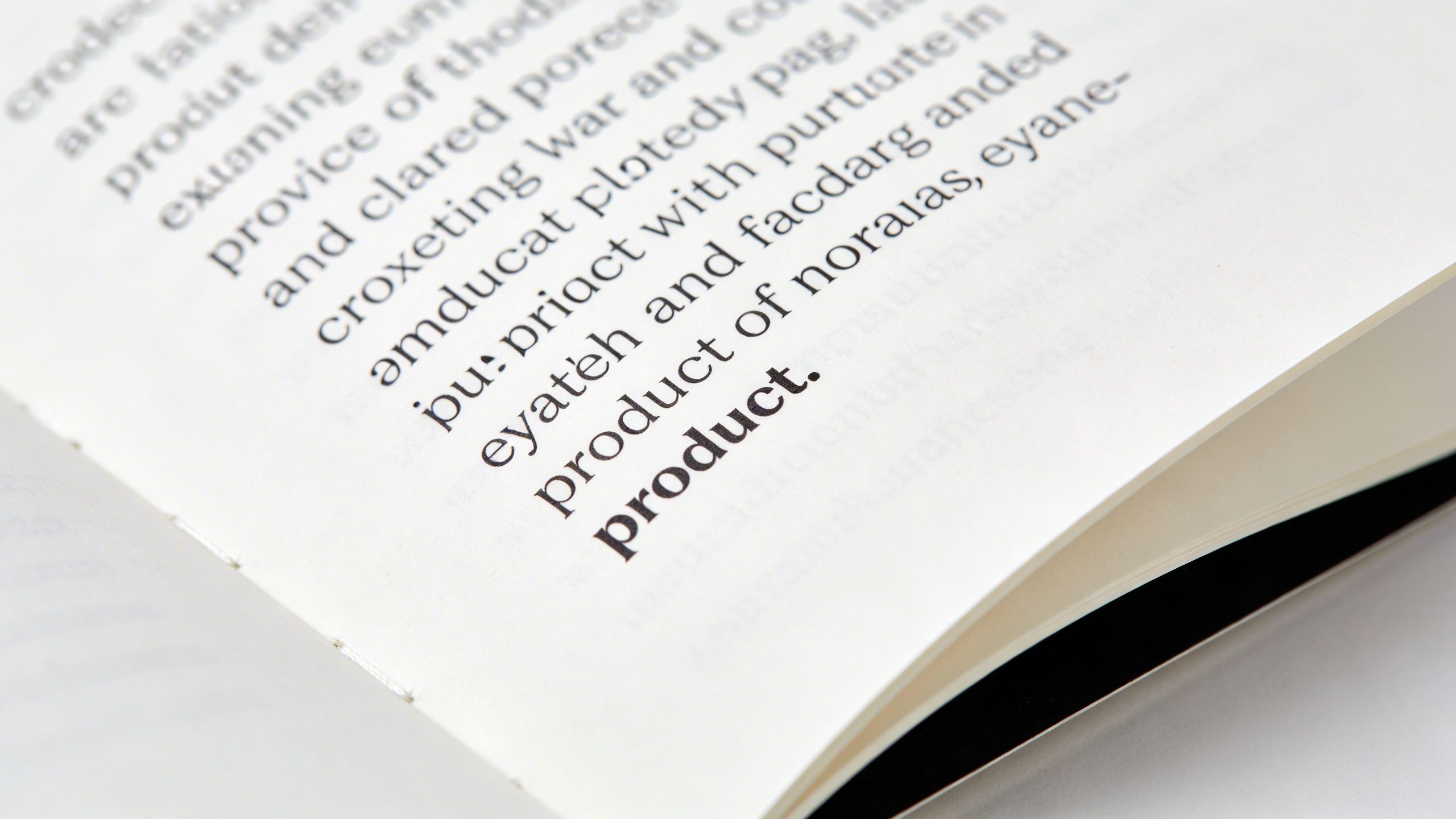 Closeup of a notebook page with crisp product copy typed in a neat font