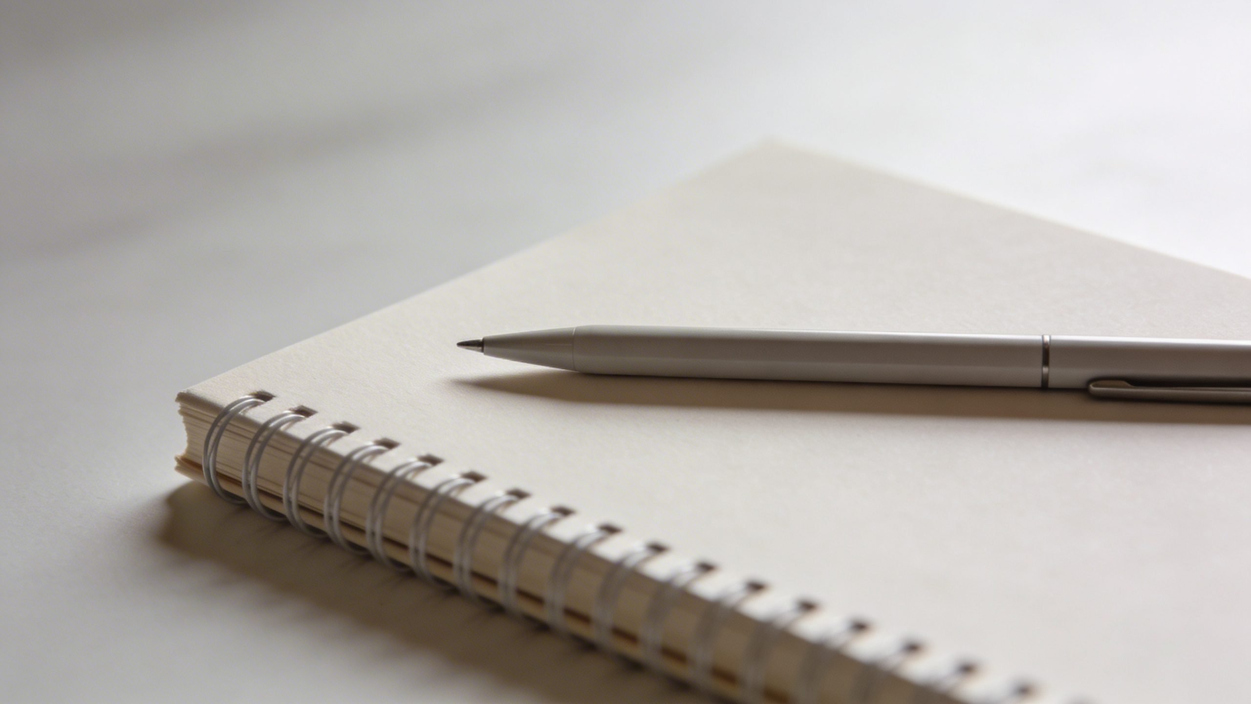 Focused shot of a minimalist budget notebook with pen