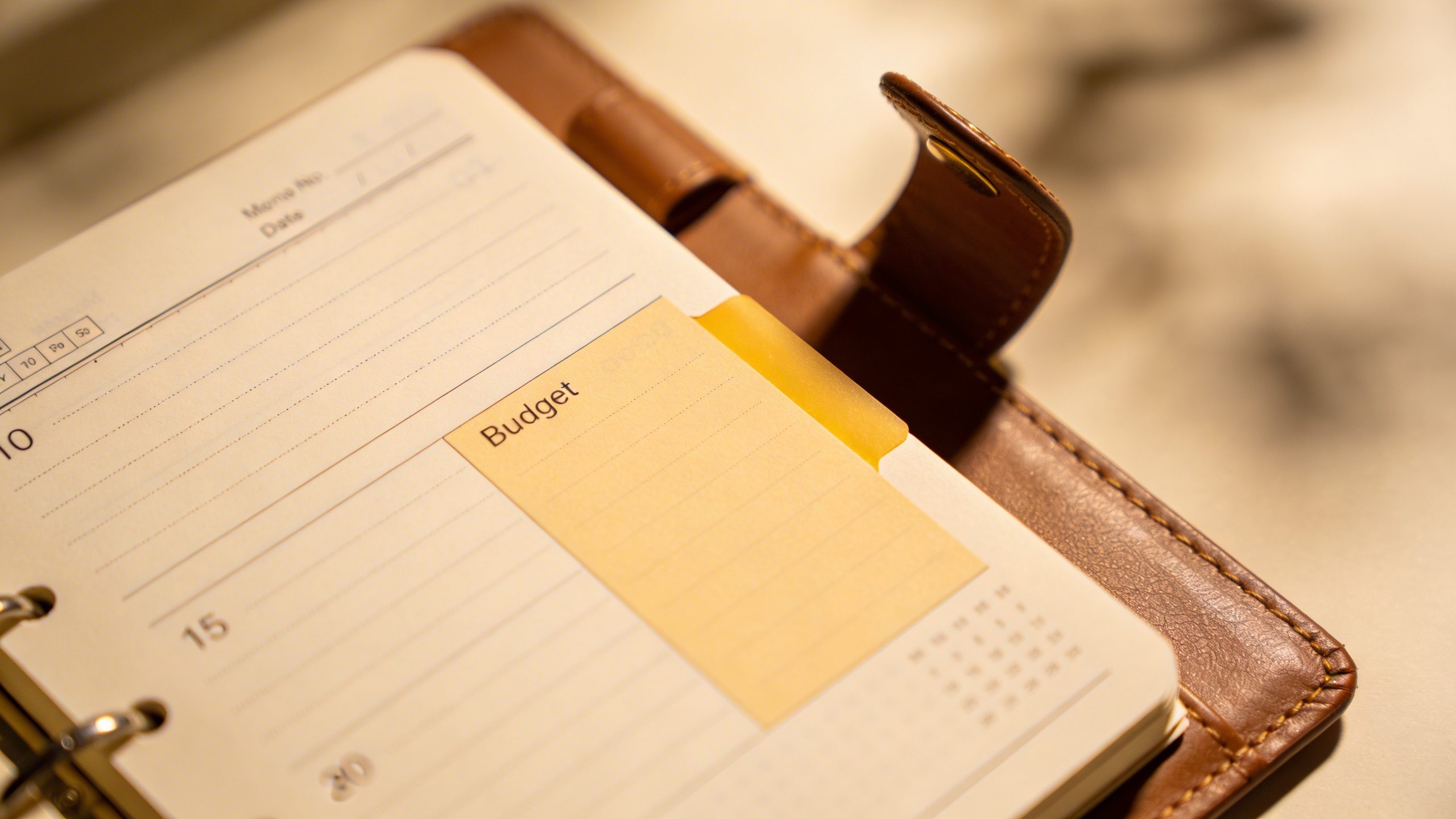 Closeup of a single notebook with a highlighted budget page