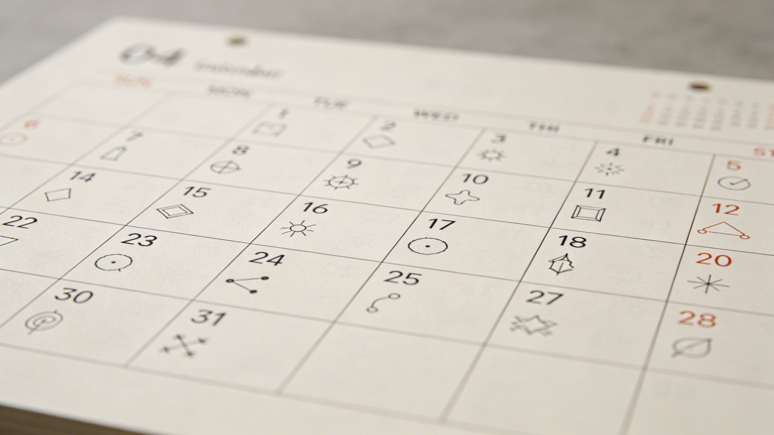 Closeup of a calendar with daily small experiments tracked neatly